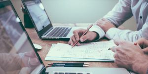 Top Professional Report Writing: A professional reviewing a document, exemplifying Professional Report Writing.
