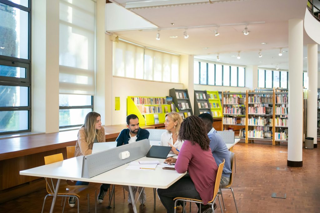 essay help London Group of university students studying together in a London library - ideal for essay help London
